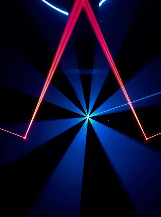 Disco laser lights projected by the LaserCube laser light projector indoors