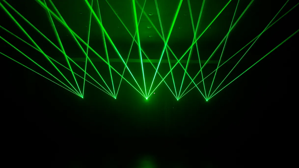 Green laser show lights created by the LaserCube projector