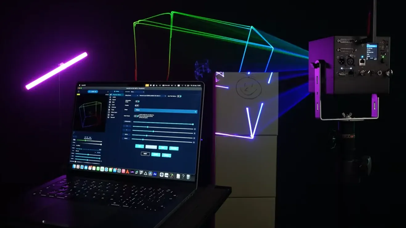 LaserOS projector settings on a laptop next to a LaserCube projecting a box outline