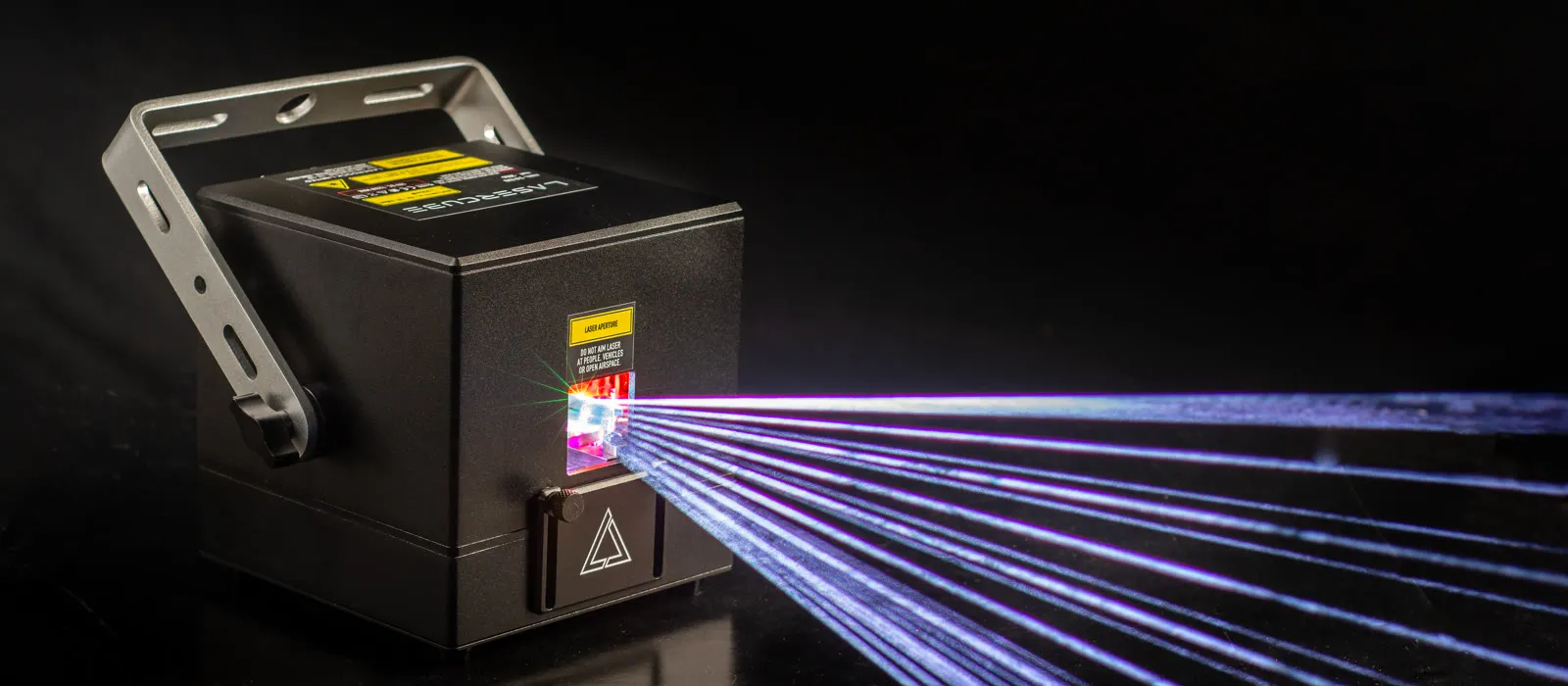 LaserCube Pro with its bracket raised, projecting a fan of white laser beams in a dark studio
