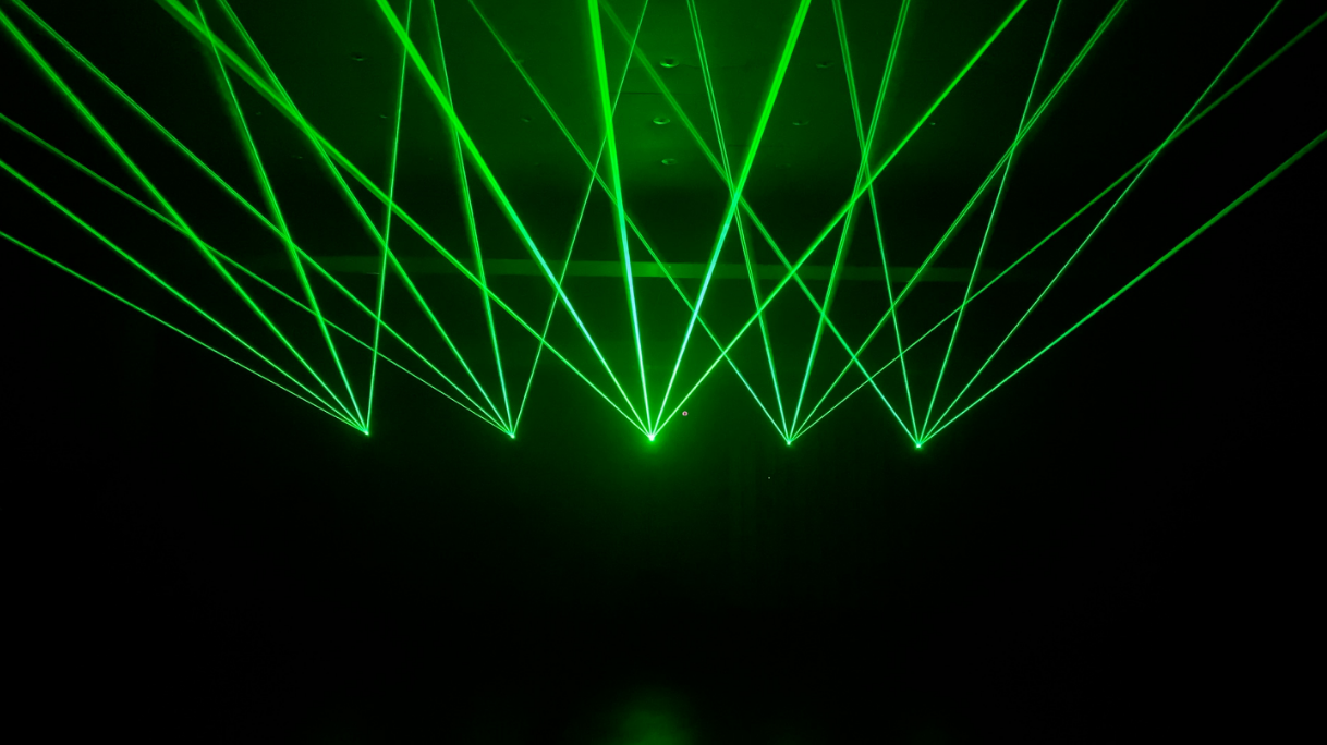 image_2022_01_13T06_16_56_026Z Green laser lights being projceted by a 3D laser projected called Lasercube