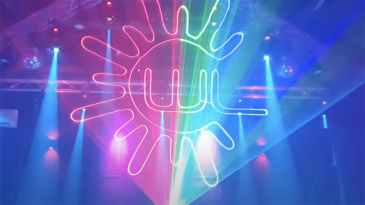 image_2022_01_13T07_01_34_291Z-1 Holographic laser light design by Lasercube being used in a club, showing 3D lights projection over smoke.